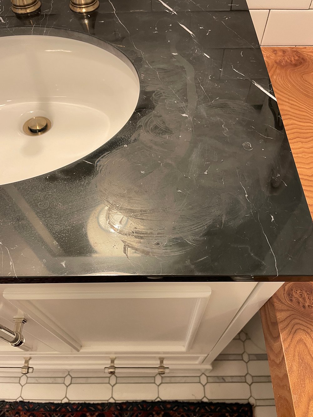 Honing Our Guest Bathroom Nero Marble Countertops - roomfortuesday.com