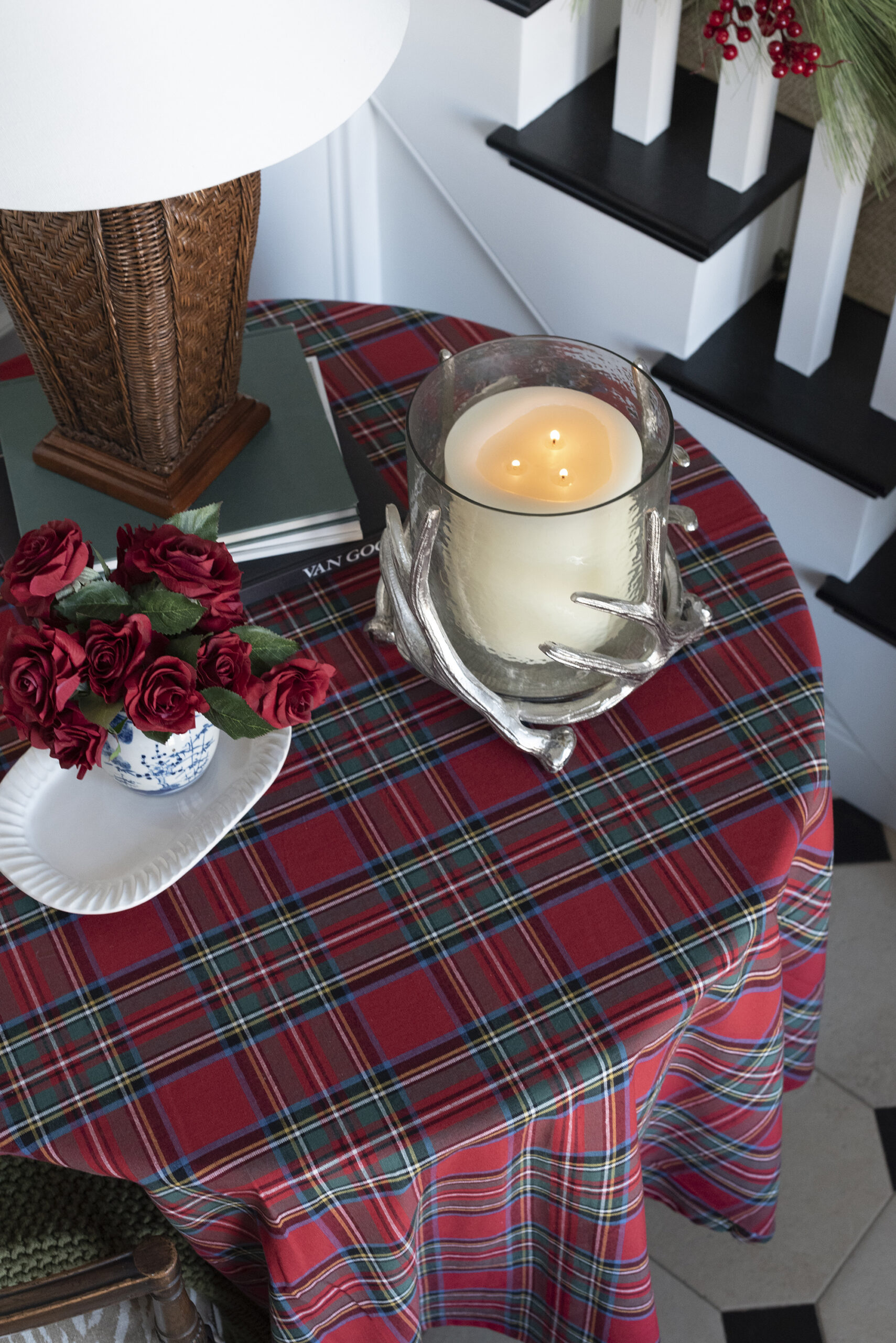 Candle in Horn Glass Hurricane on Red Tartan Table with Lamp