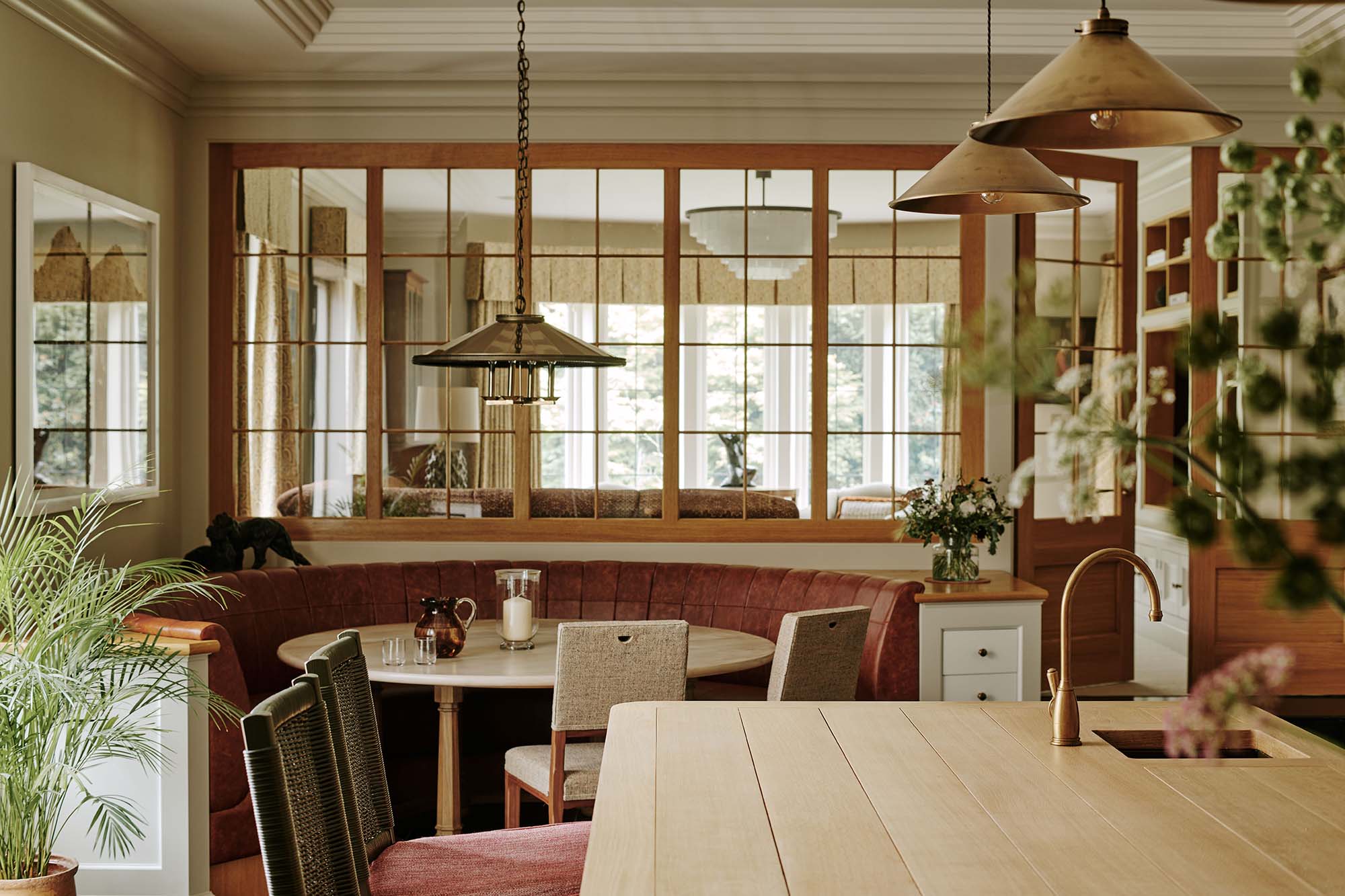 Kitchen-Island-and-Breakfast-Nook-with-Brass-Fixtures
