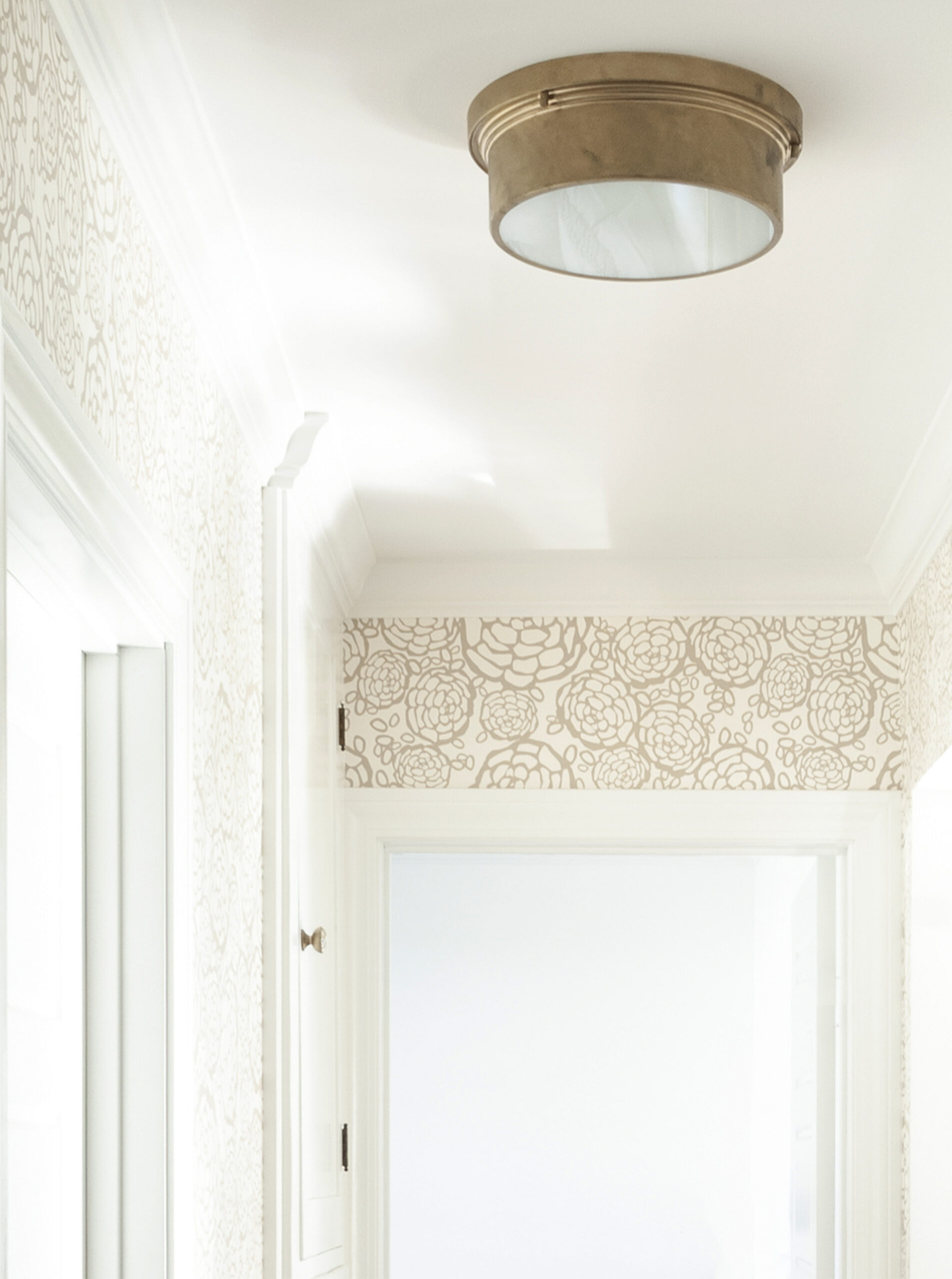 Brass Flush Mount Light Fixture in Wallpapered Hallway