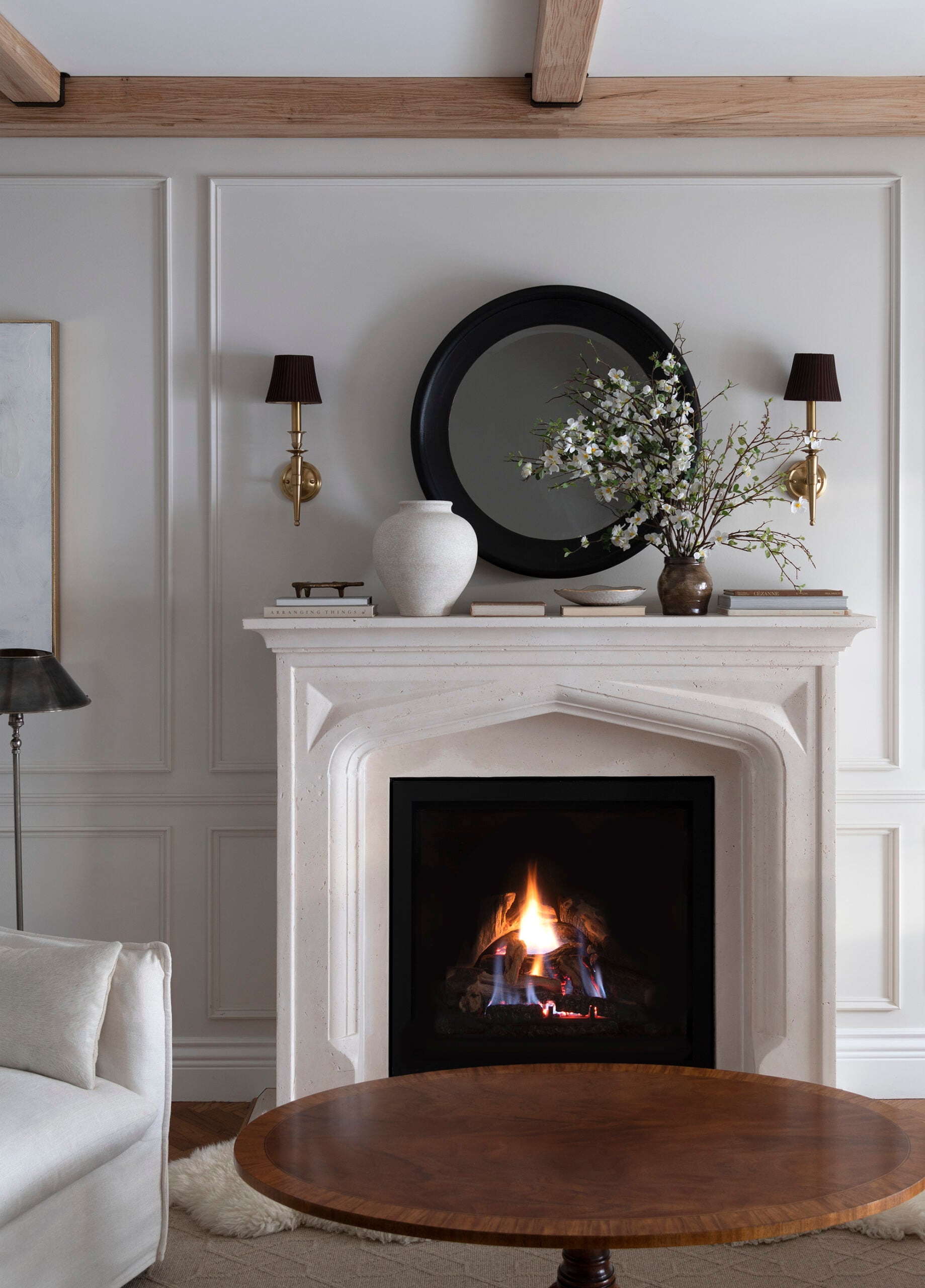 Fireplace with Spring Florals, Sconces, and Antique Coffee Table