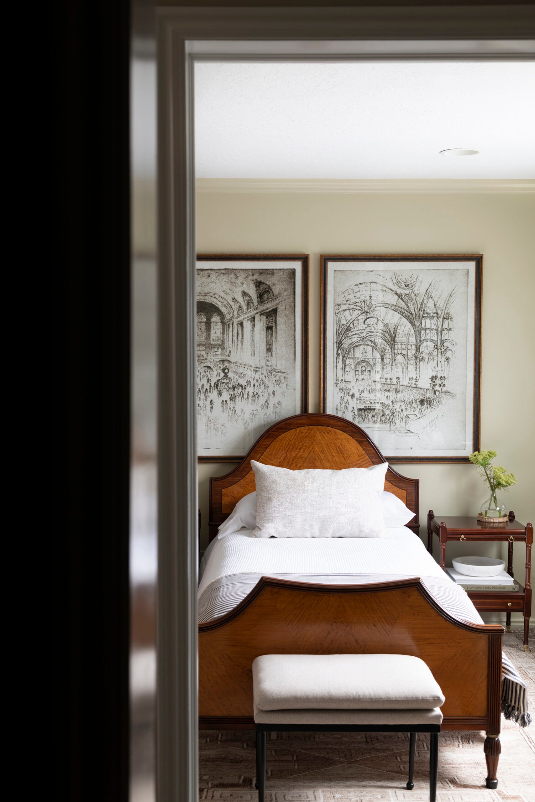 Vintage Wood Bed with Large Art and Cozy Rug in Basement Bedroom