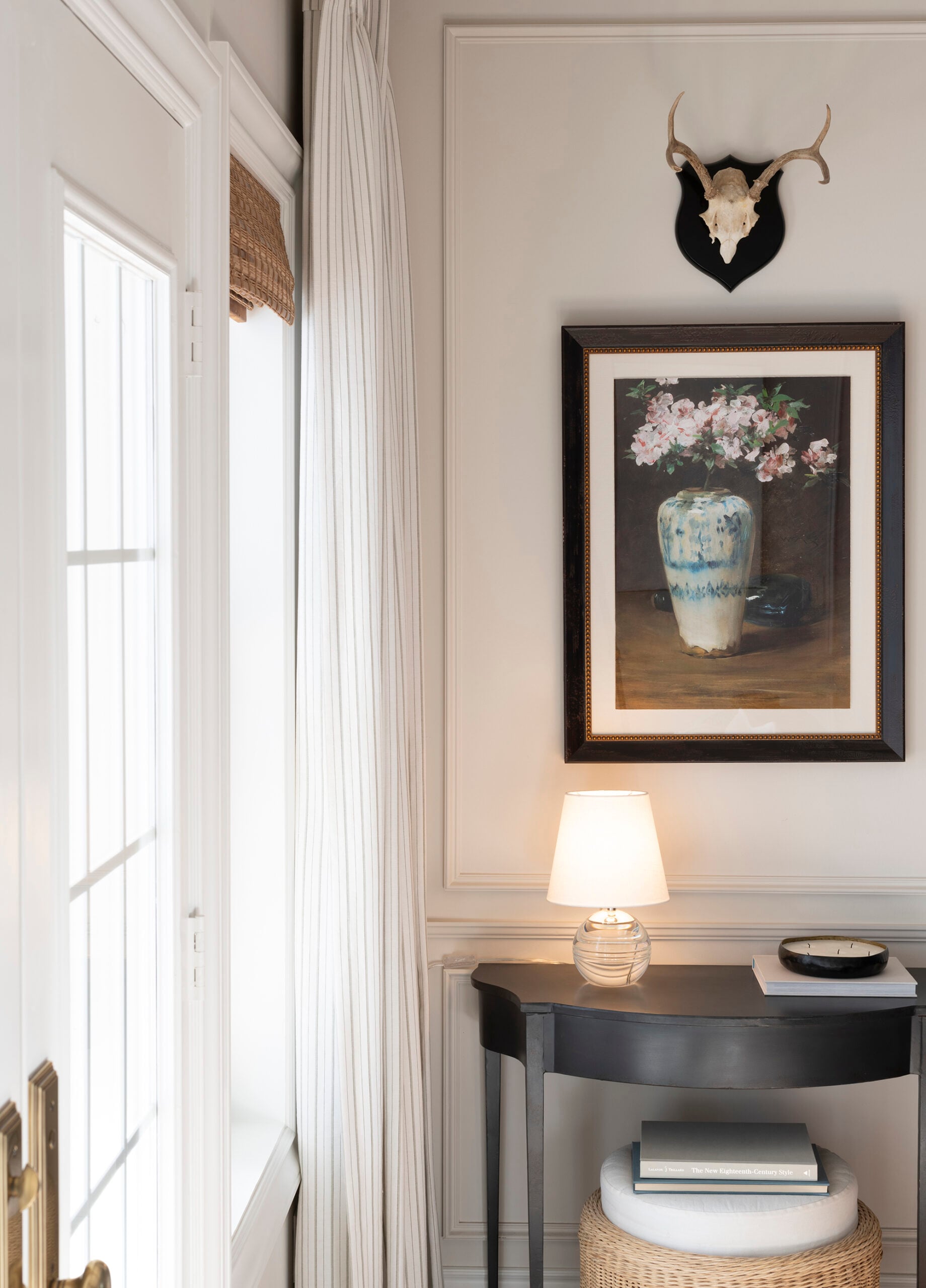 Blue and White Still Life Artwork Above Demilume Table and Crystal Lamp