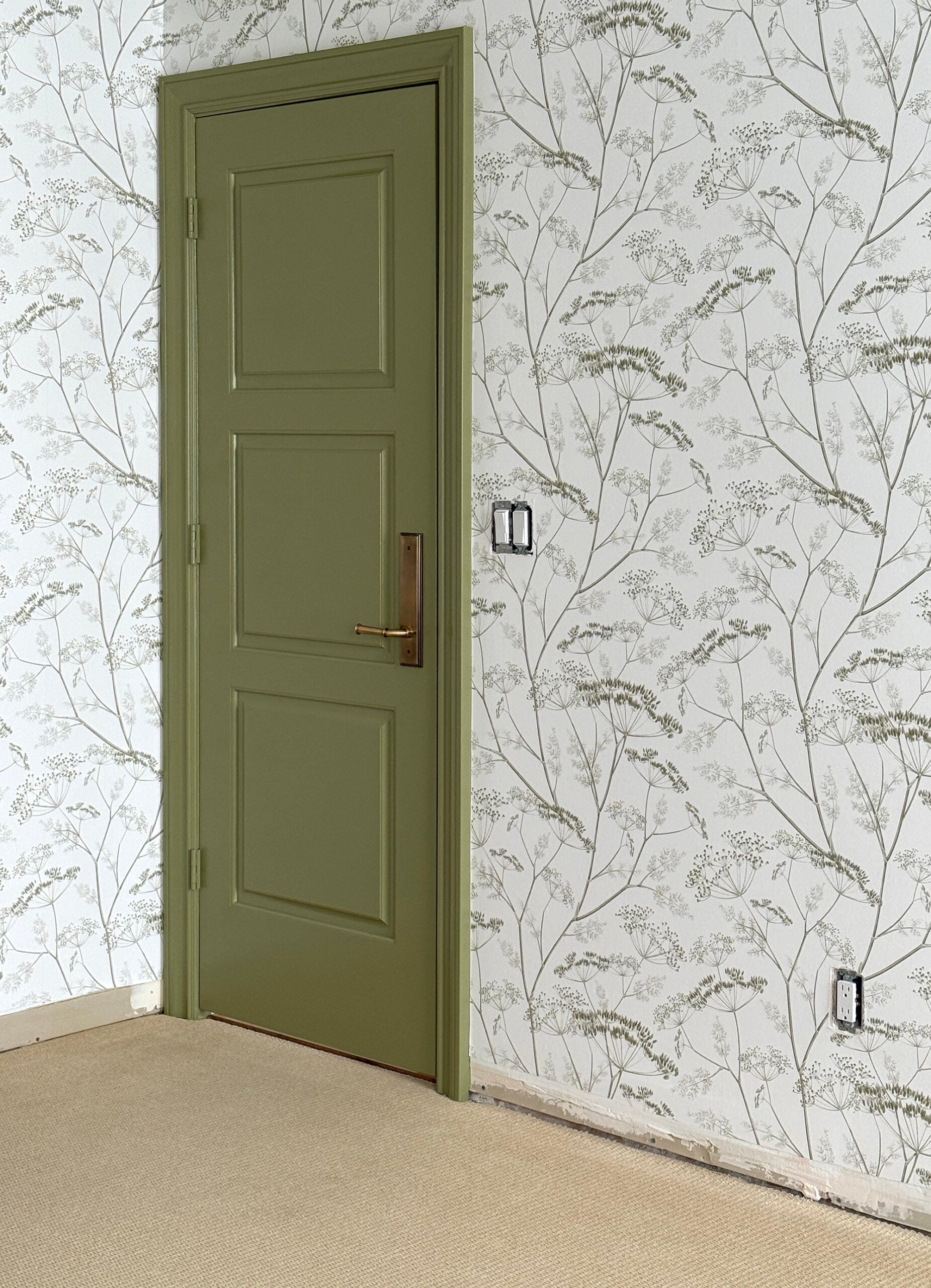 Green Door with Floral Wallpaper in Nursery