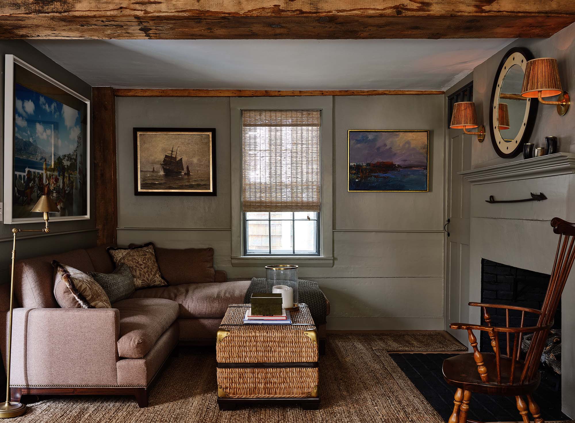 KristinPaton-Nantucket Sitting Room with small sectional fireplace Nautical Art and Wood Beam