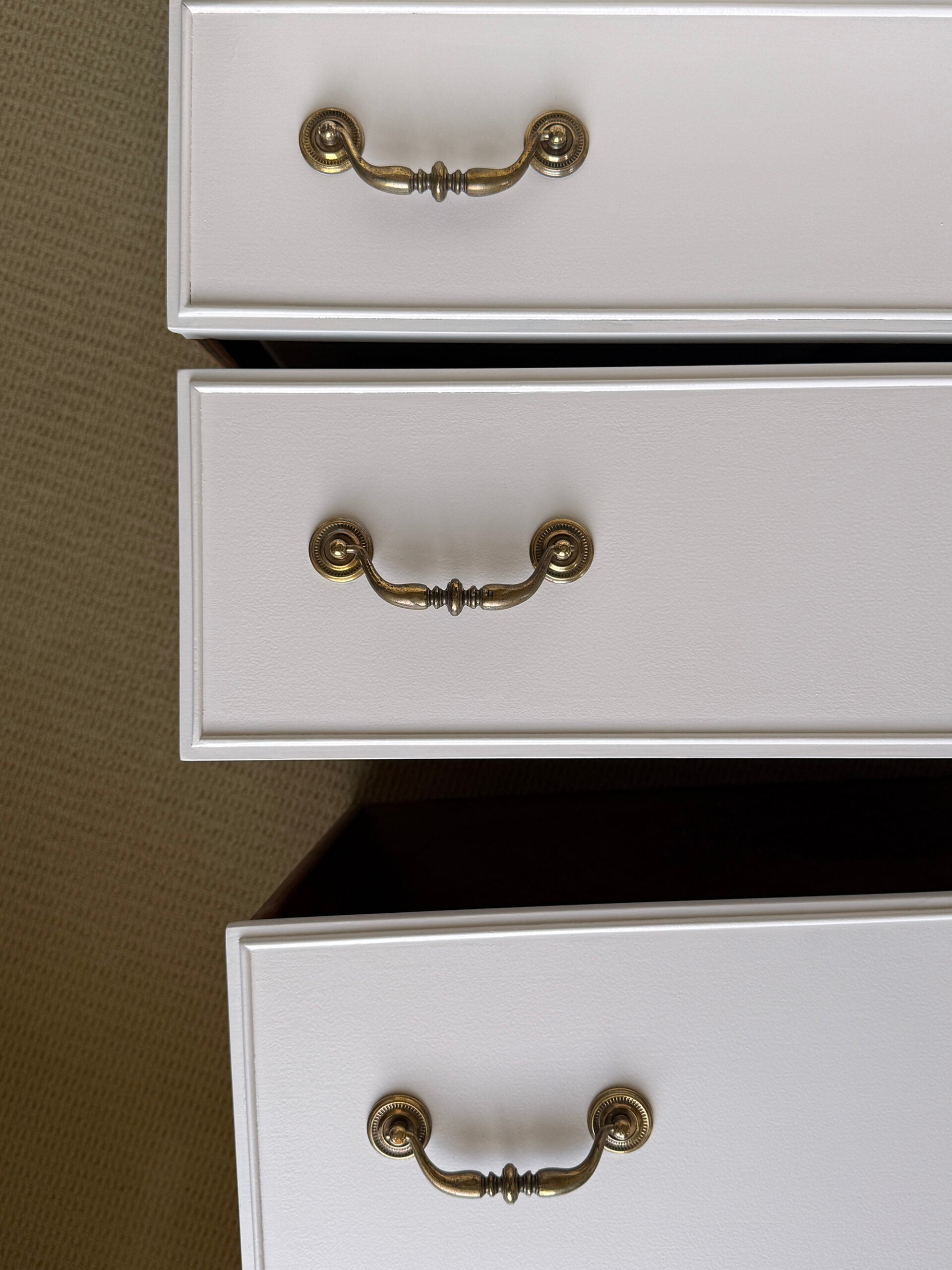 Drawers with Newly Installed Polished Brass Hardware on Dresser Makeover