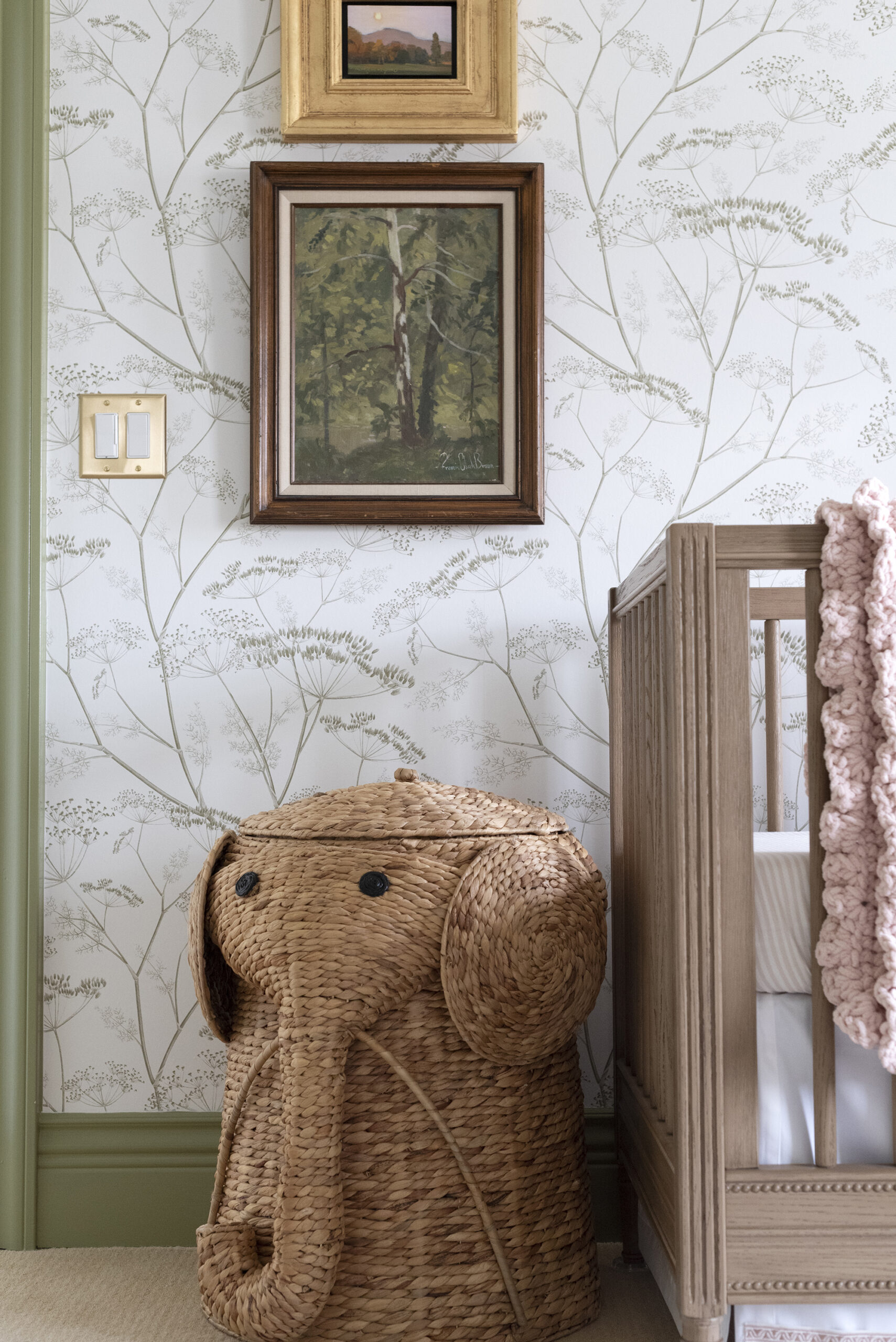Elephant Laundry Hamper Next to Baby Crib