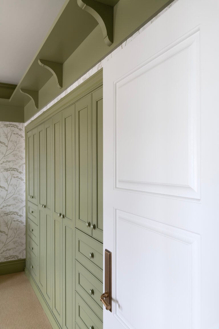 Green Built in Closet in Girls Nursery with Shelf Around the Room