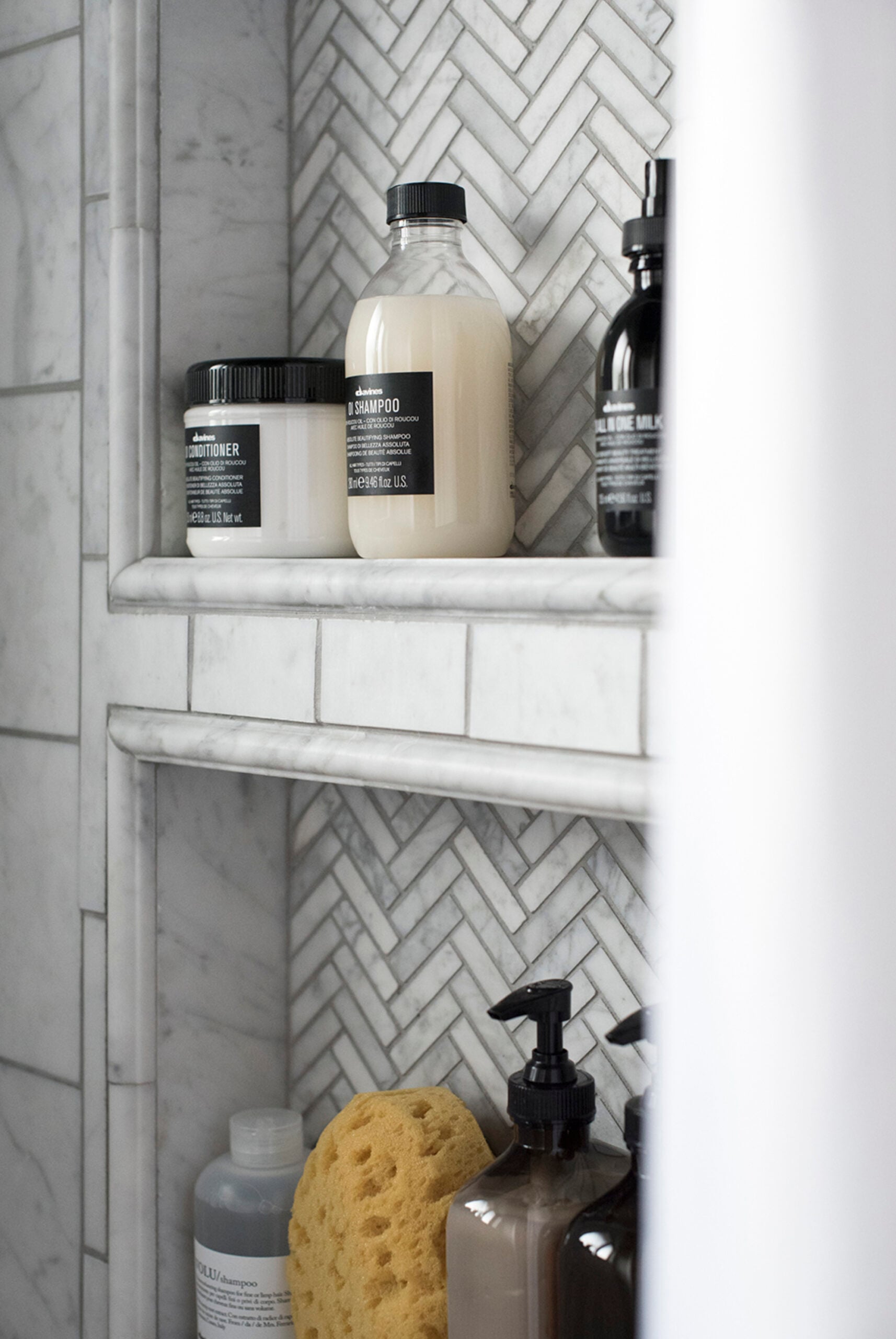 Herringbone Marble Mosaic in Shower Niche