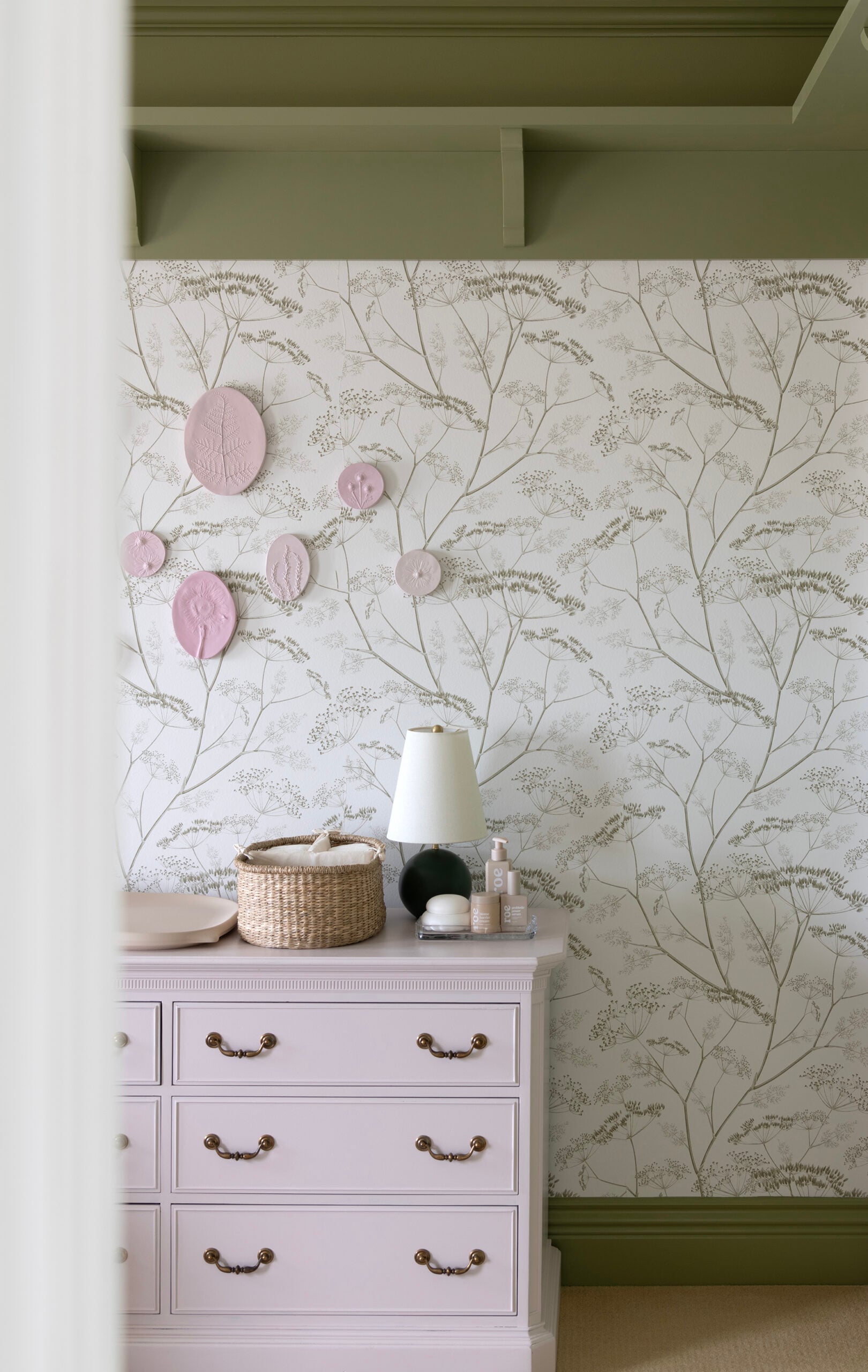 Plaster Floral Relief Intaglios Hanging Above Changing Table in Nursery