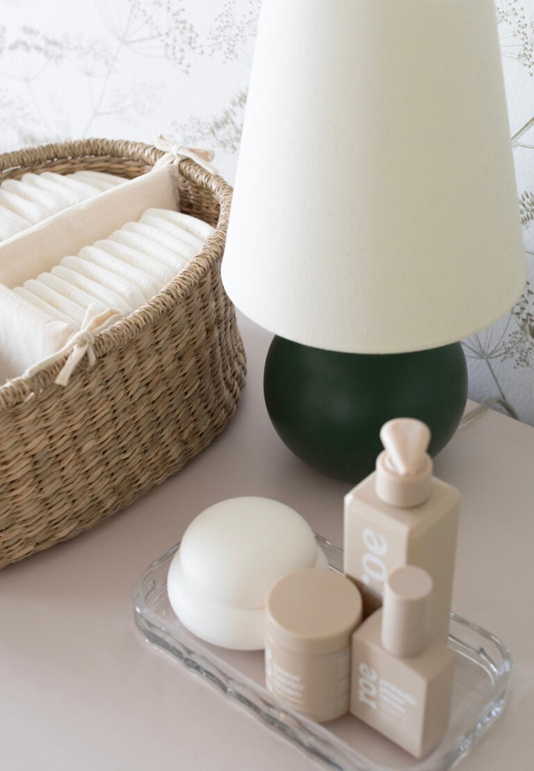 Small Table Lamp on Nursery Changing Table Dresser with Diaper Caddy and Roe Baby Products