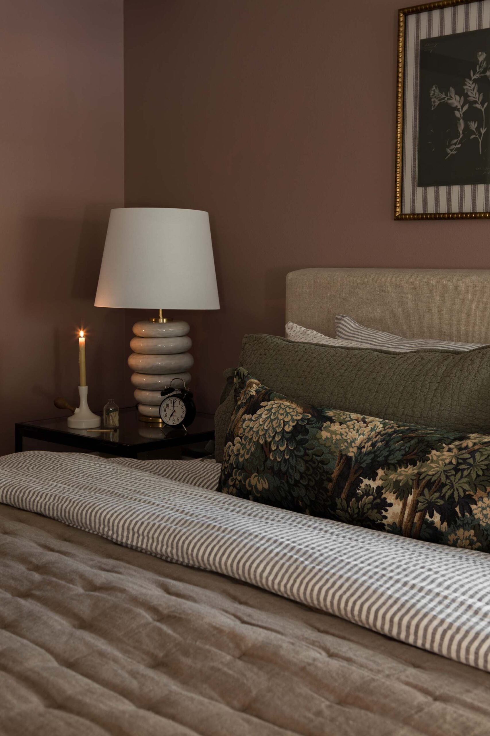 Oho Interiors-Carriage House-Bed with lumbar pillow nightstand with lamp and candle