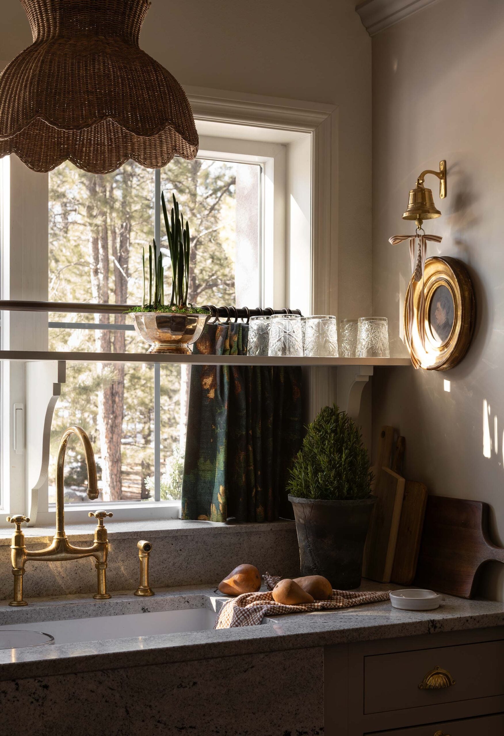 Oho Interiors-Carriage House-Kitchen Sink with single basin Brass Bridge Faucet with Side Spray Woven Pendant Light Dinner bell with art
