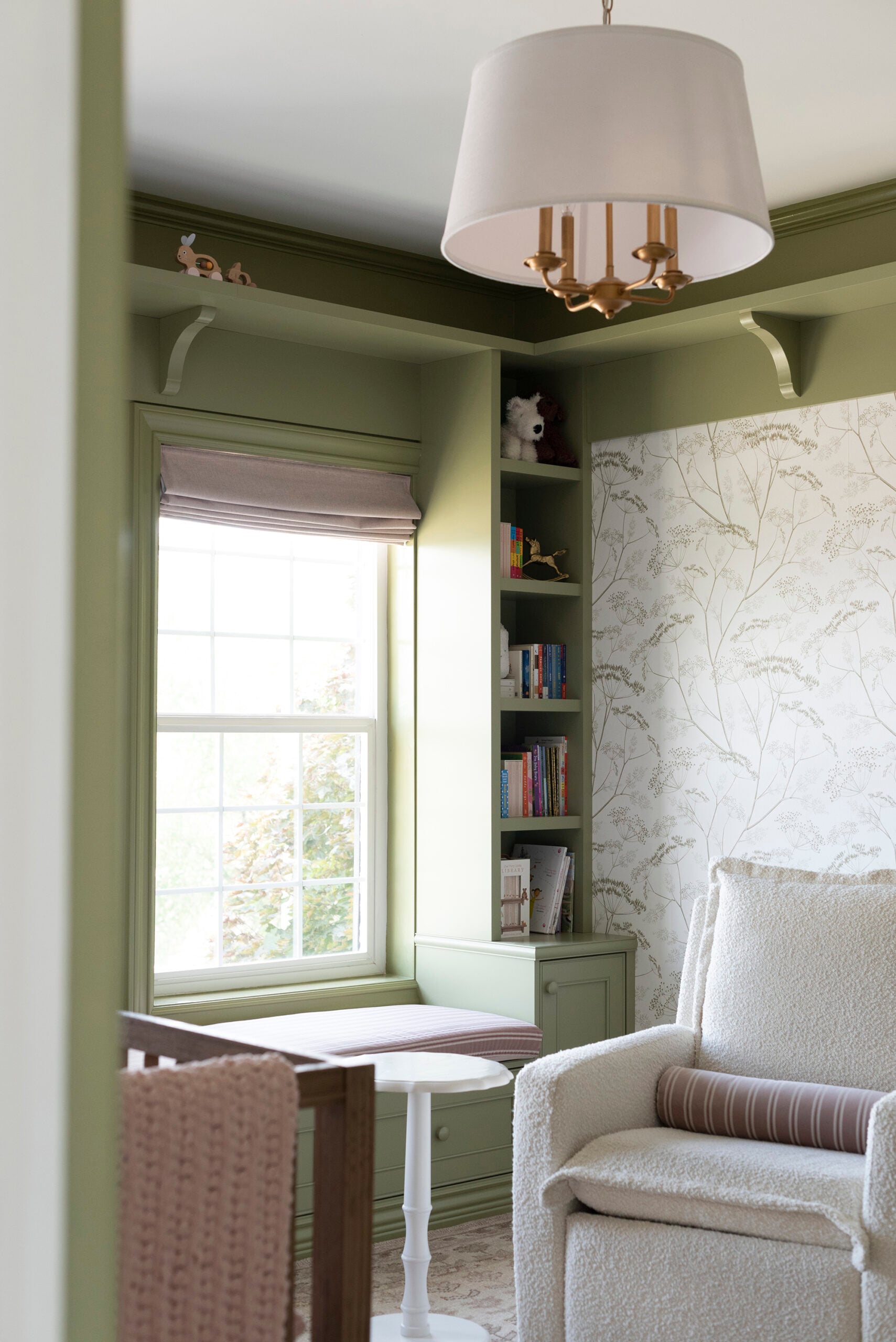 Oilo Swivel Glider Chair in Green Nursery with Floral Wallpaper
