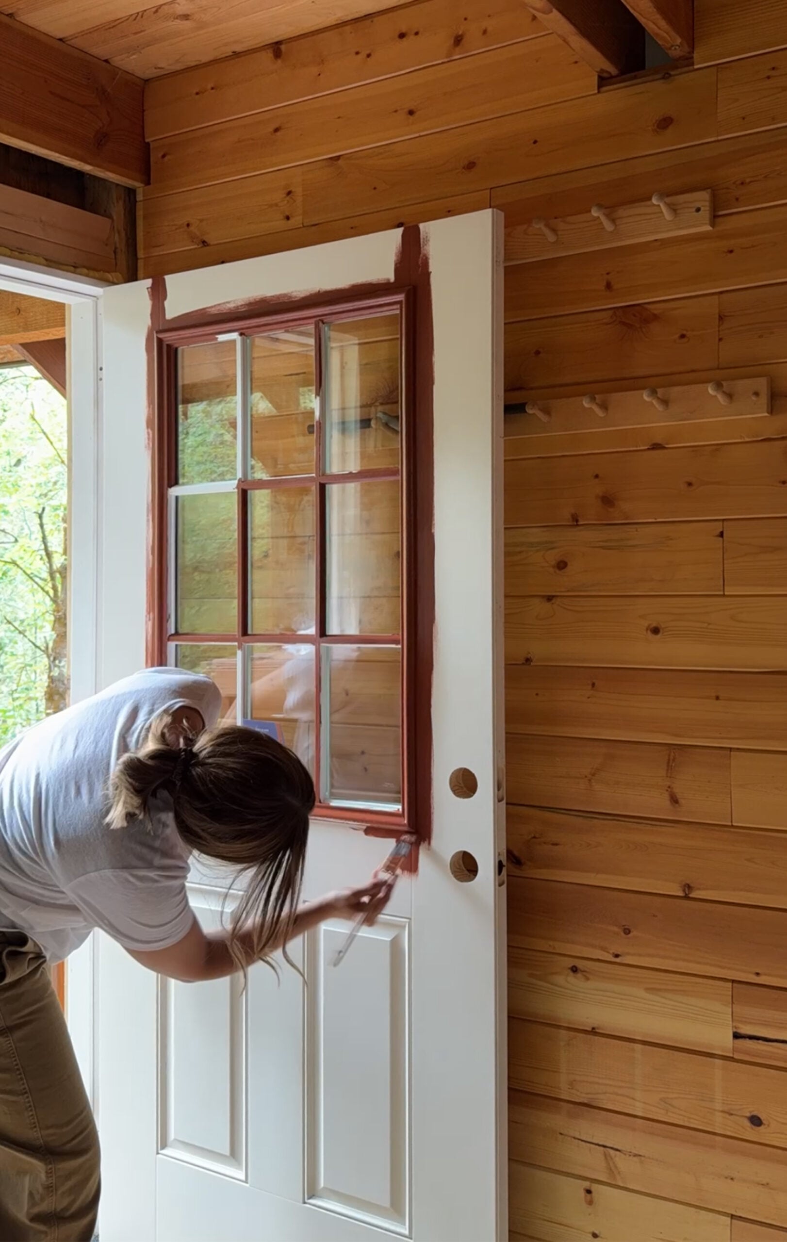 Painting a Front Door on a Cabin Red