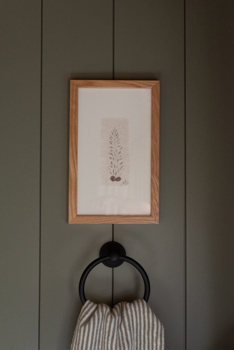 Rejuvenation Rigdon Towel Ring Installed Below Vintage Floral Art