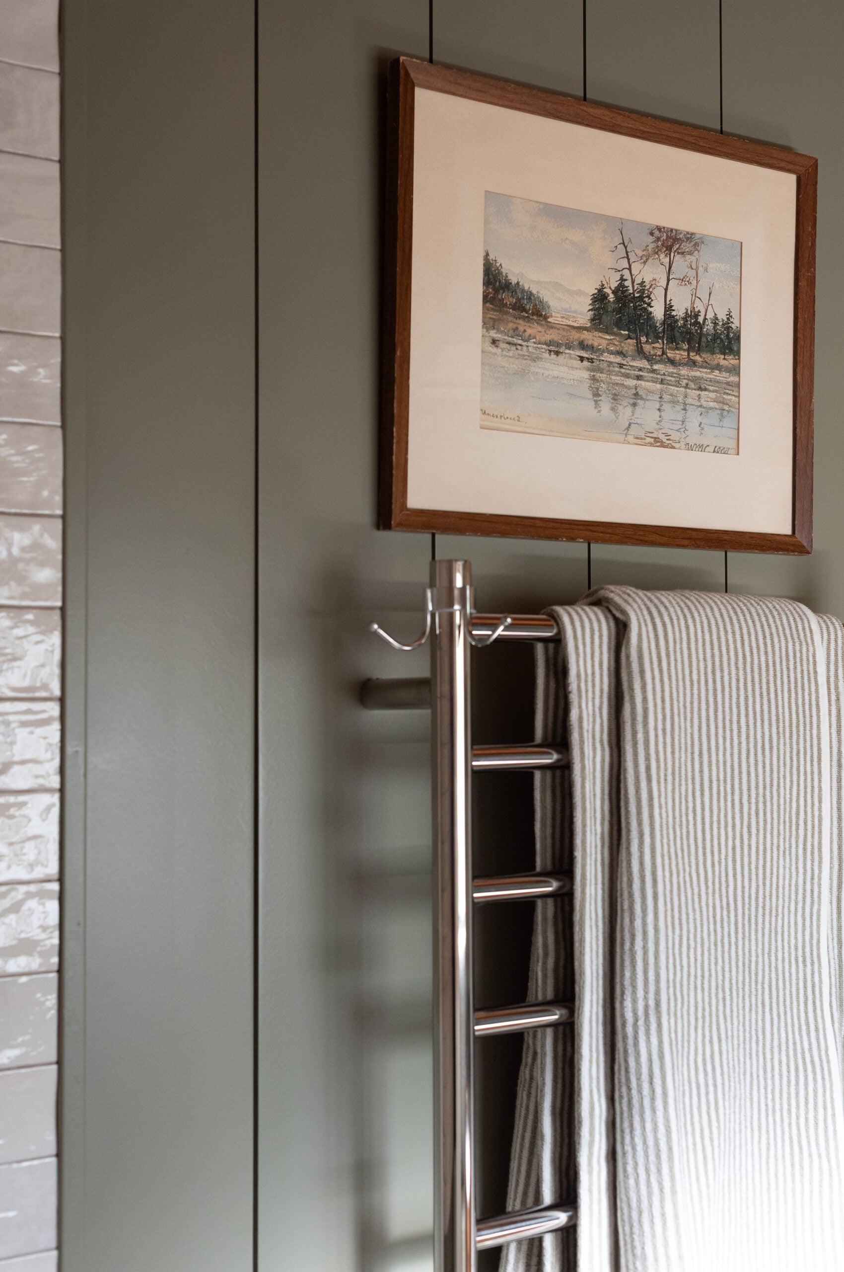Wall Mounted Towel Rack Installed Under Vintage Art