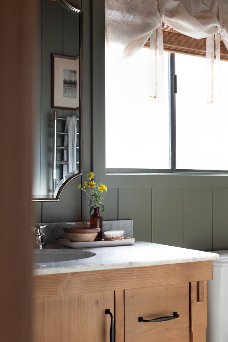 Wood Vanity with Carrara Marble Top in Cabin Bathroom