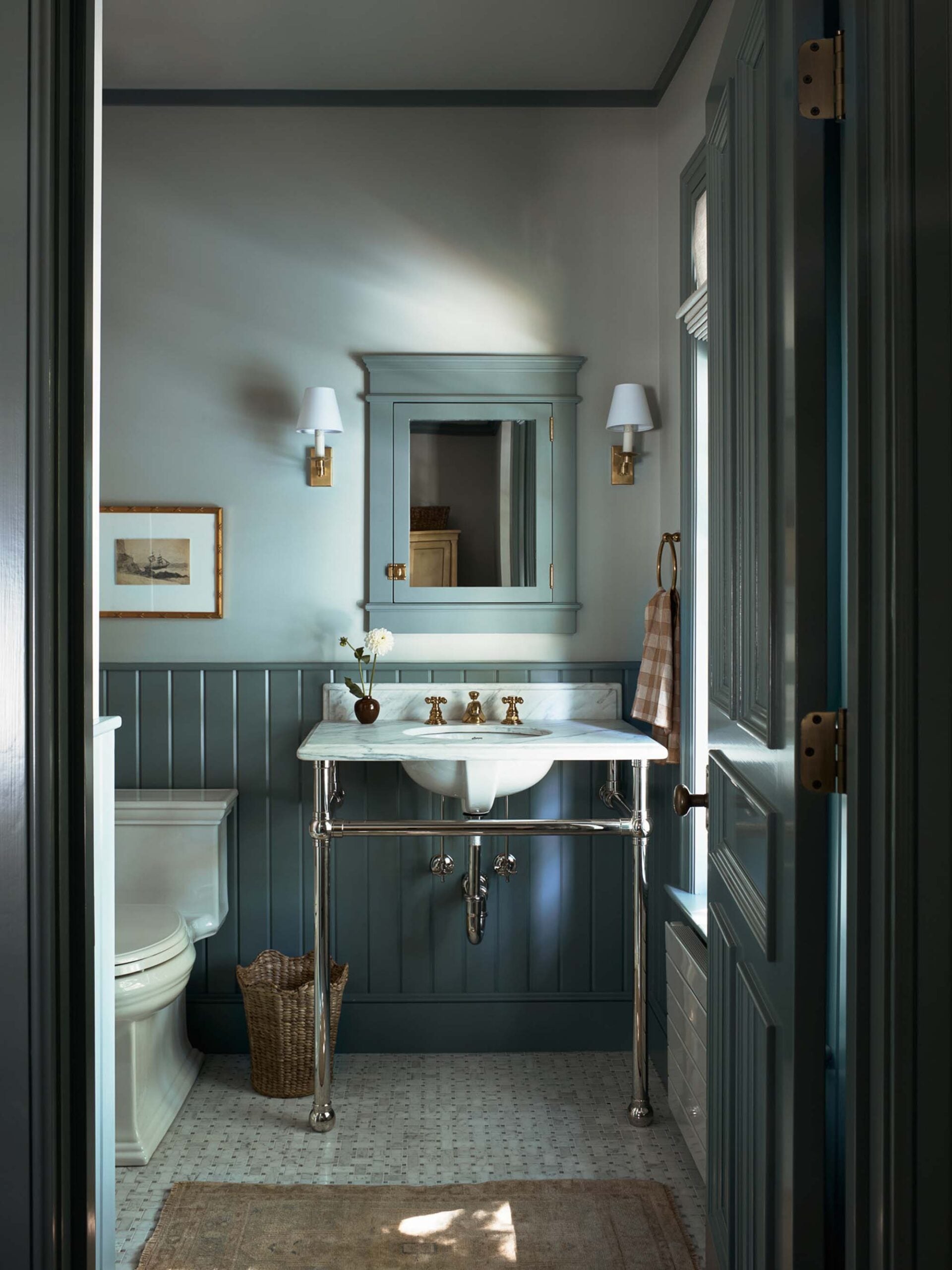 Guest Bathroom With Marble Sink and Basketweave Marble Tile Floor