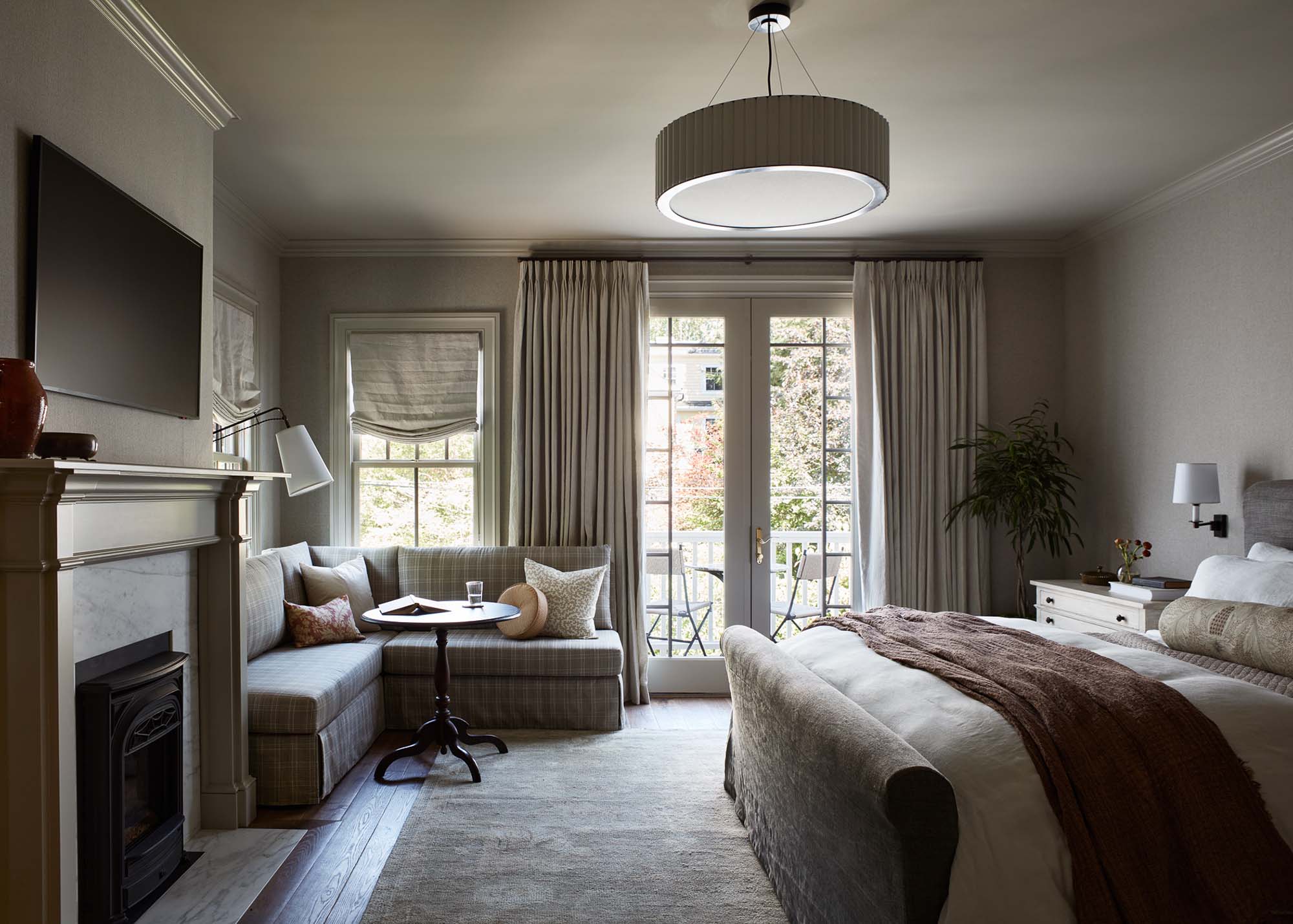 Primary Suit Bed Fireplace and Seating