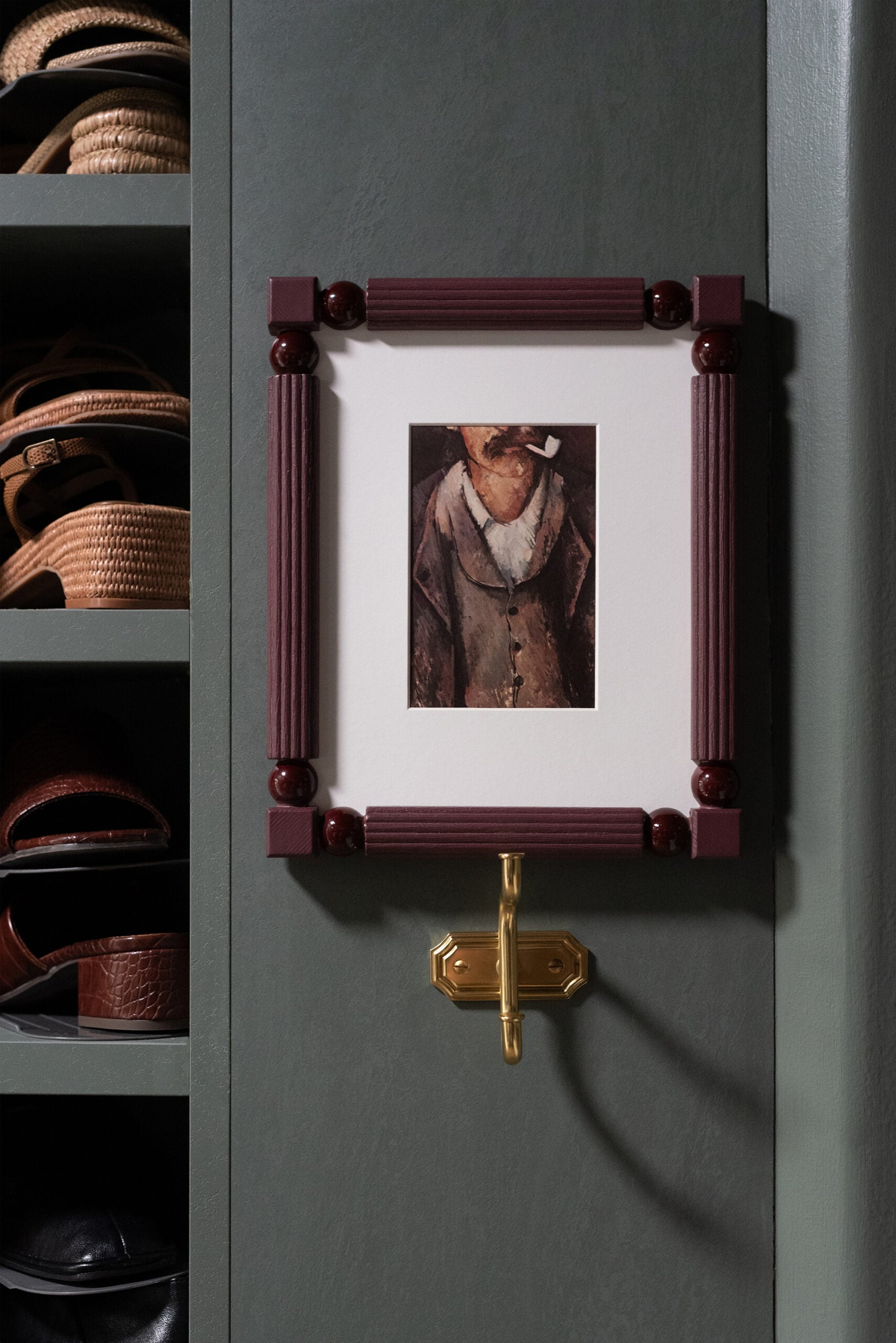 Stacked Shoes in Walk-In Closet with Cezanne Art and Brass Hook