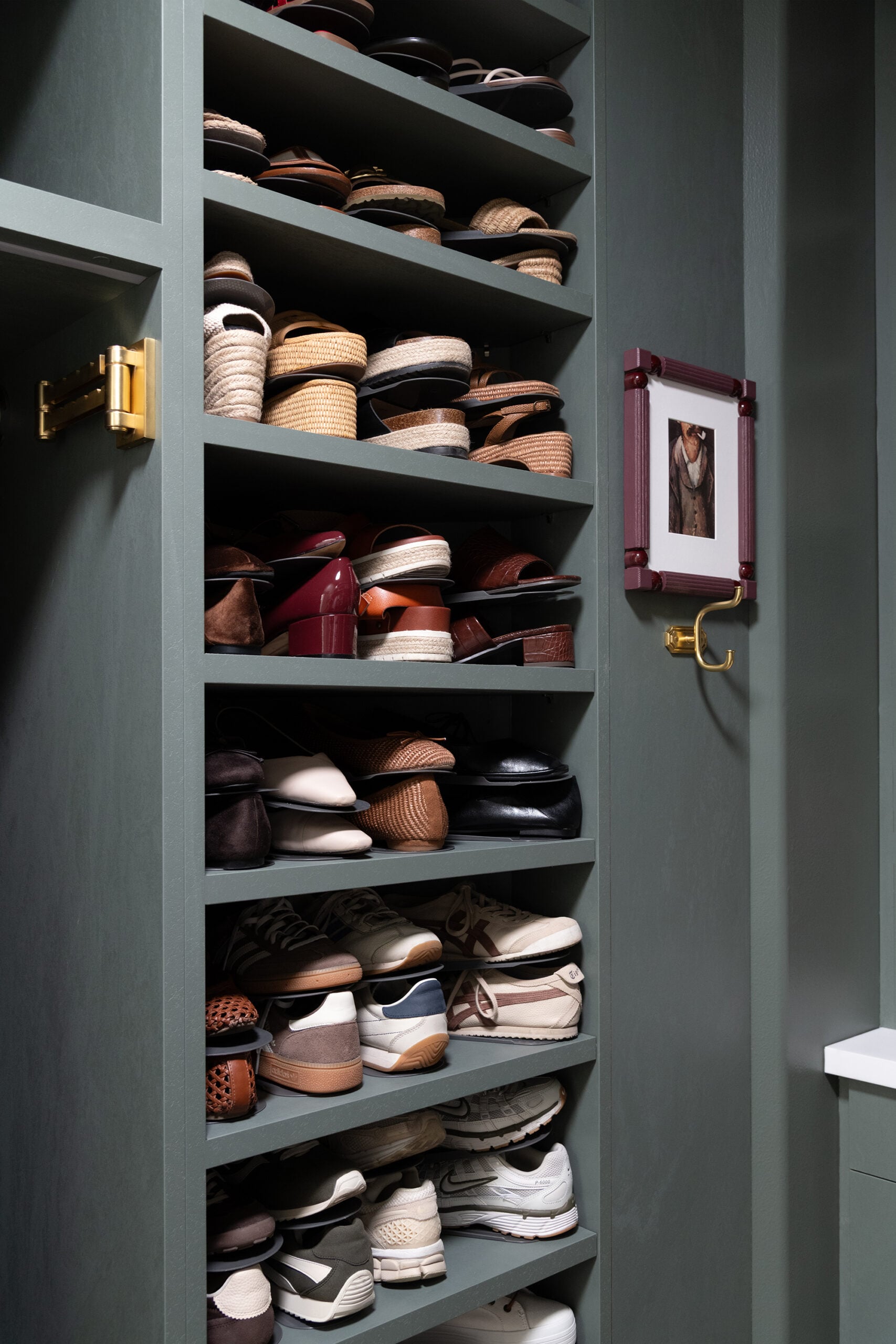 Wall of Shoes in Dark Green Walk-In Closet