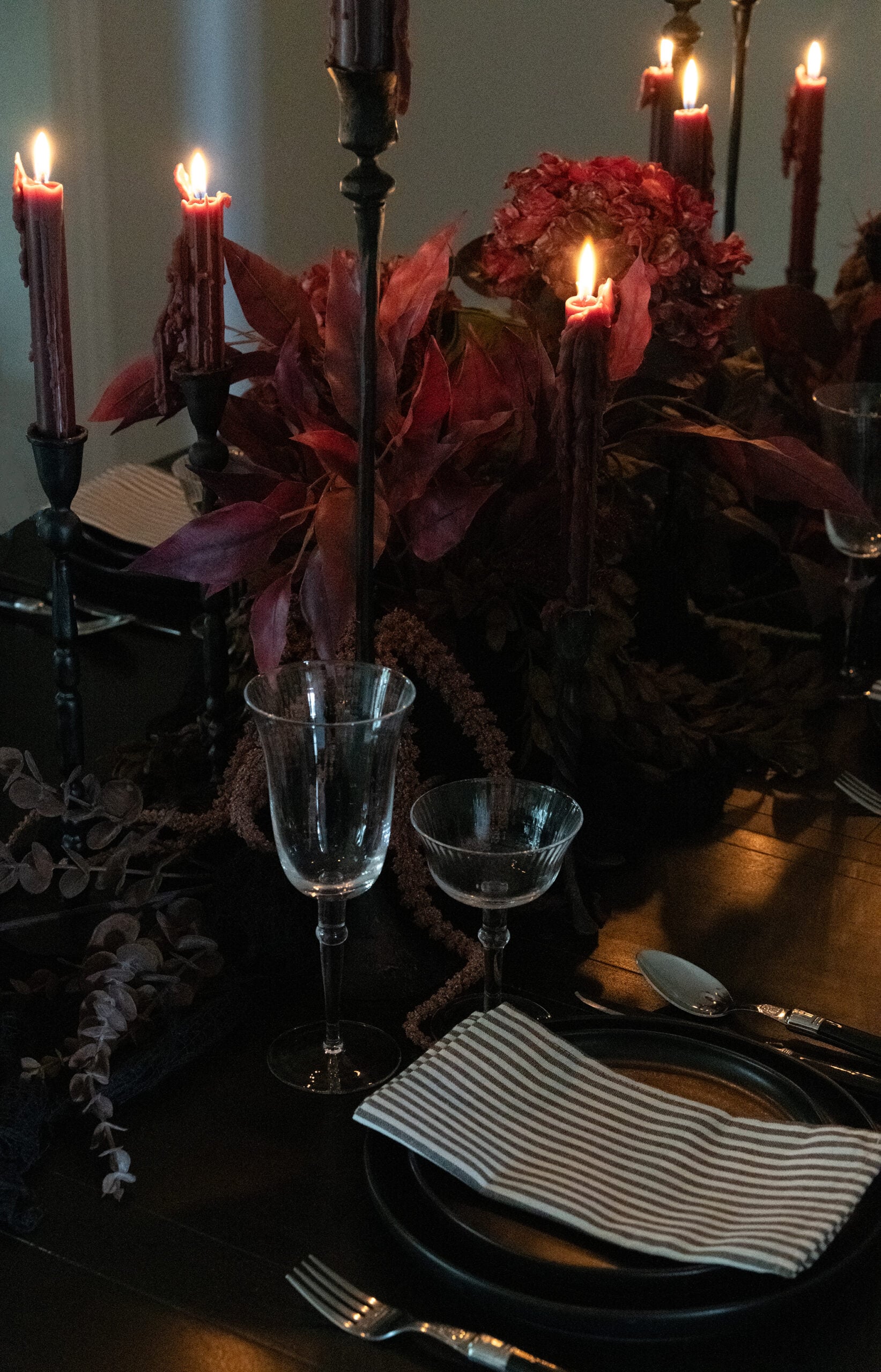 Halloween florals on dark black dining table for Halloween dinner party