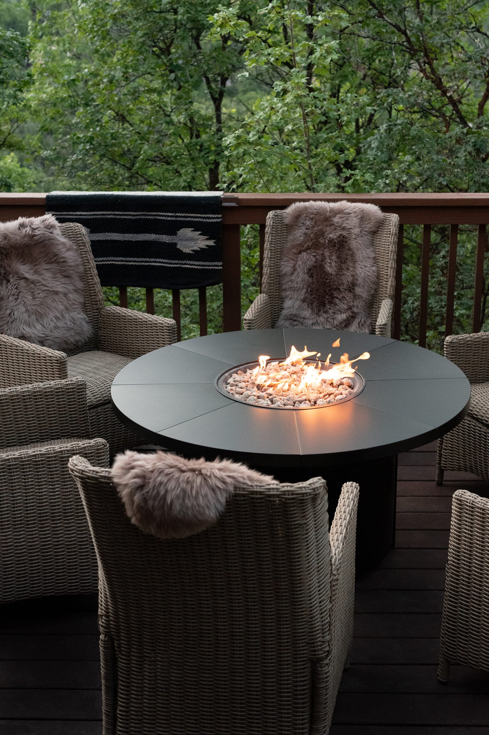 Woven Chairs Around Black Fire Table