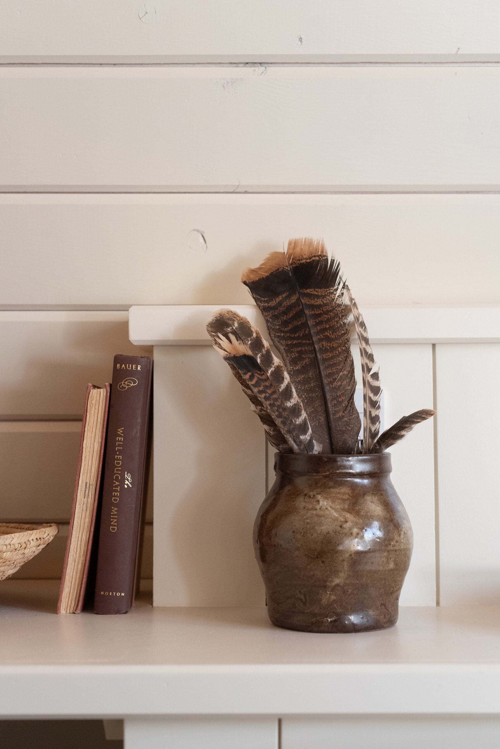 Turkey Feathers in Pottery in Cabin Bedroom