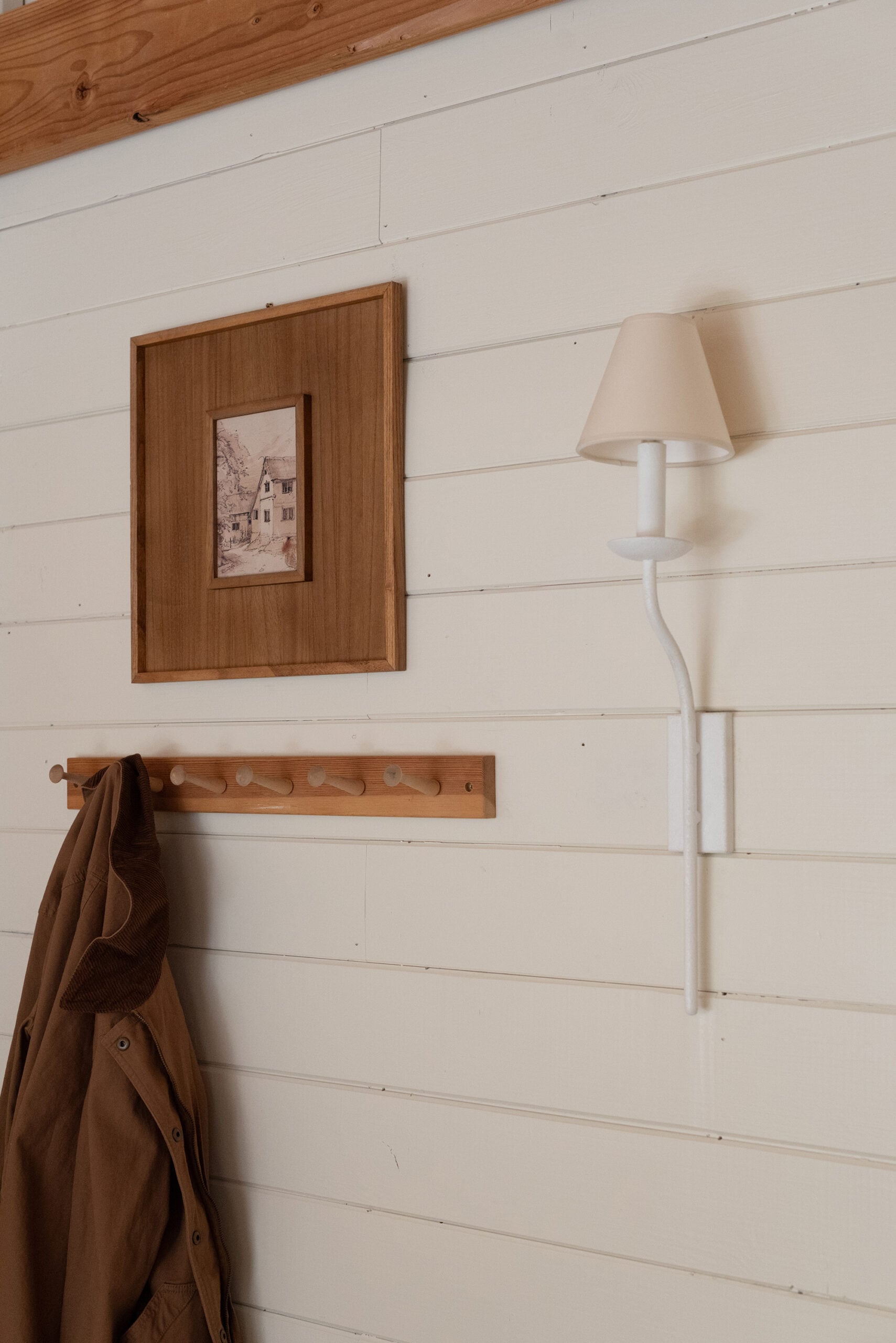 Wood Peg Hooks Under Art with Sconce and Barn Jacket