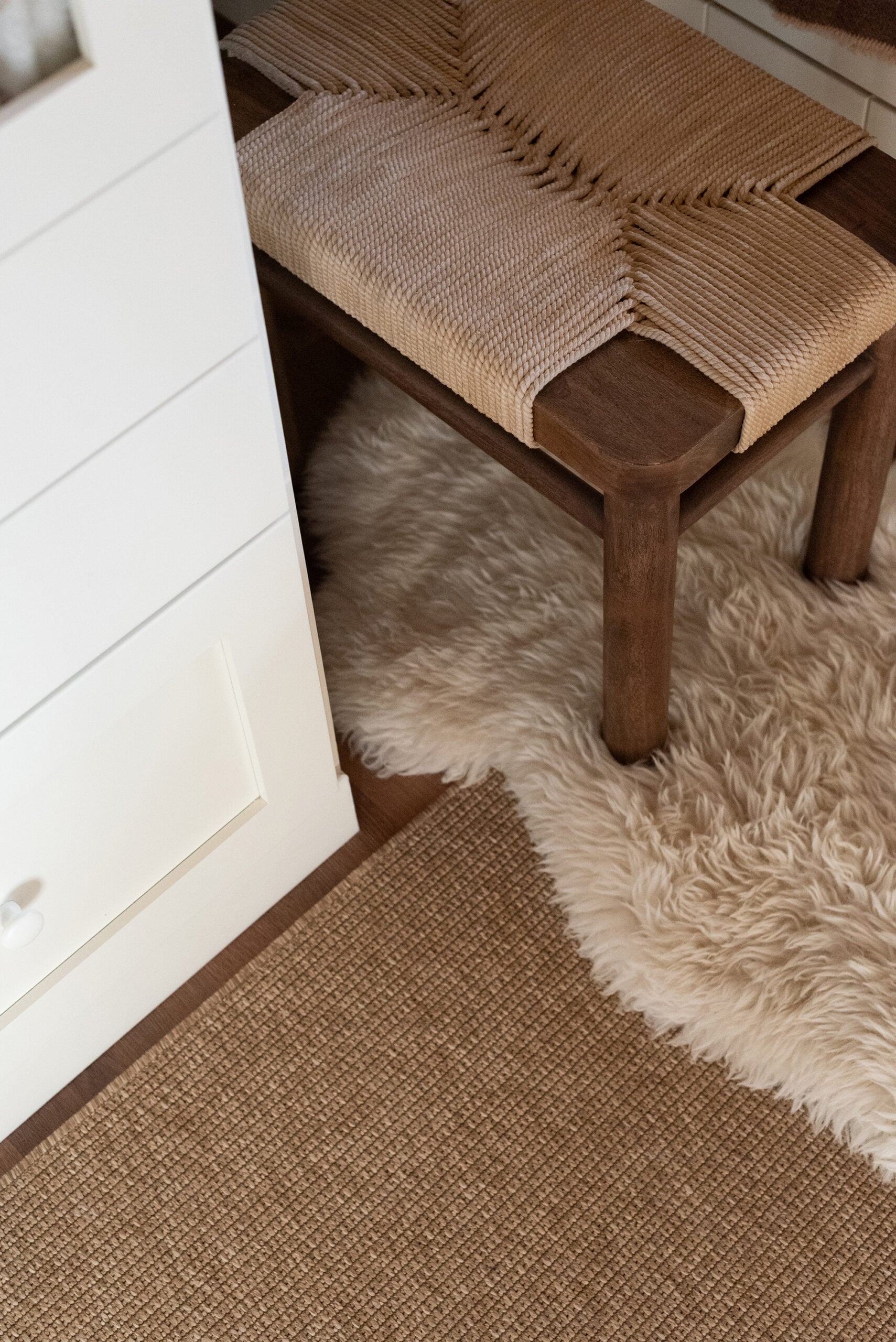 Woven Ottoman on Natural Rug with Sheepskin