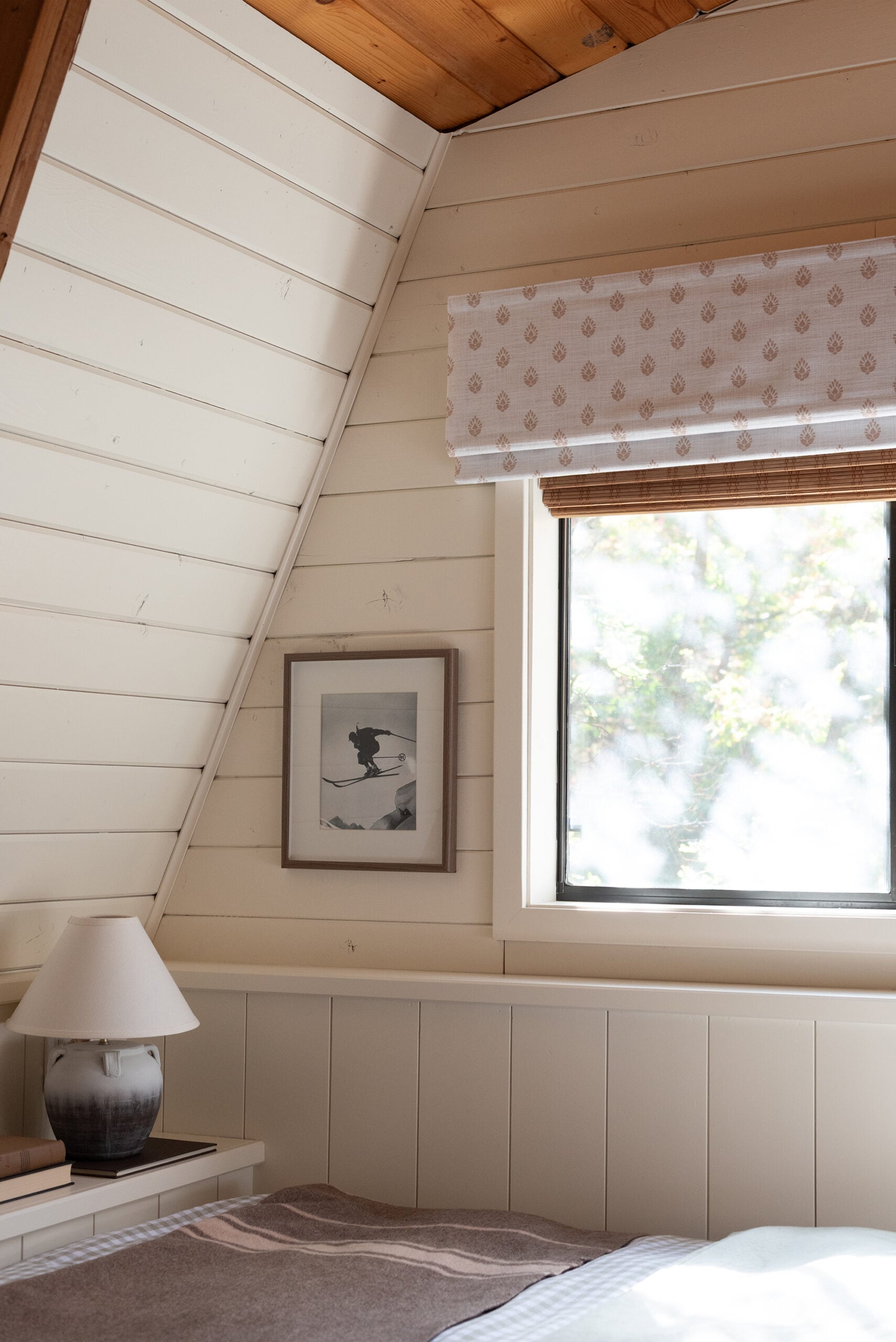 Woven and Block Print Roman Shade in Cabin Bedroom
